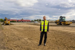 Roger Davidson inspects the building site.